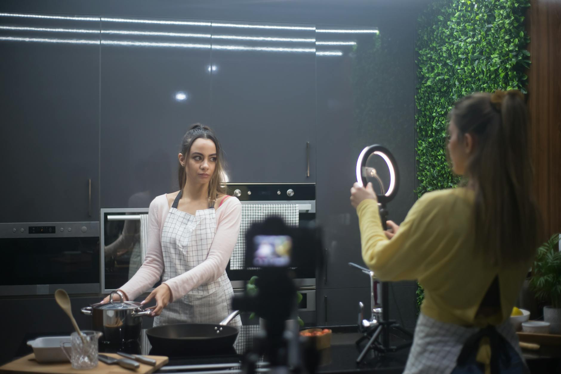 women recording cooking show